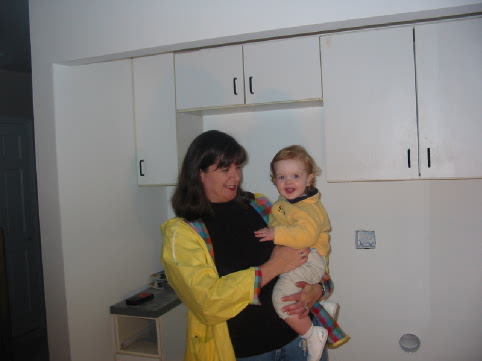 Bethany and Jane enjoying the new laundry room closet with th salvaged kitcien cabinets